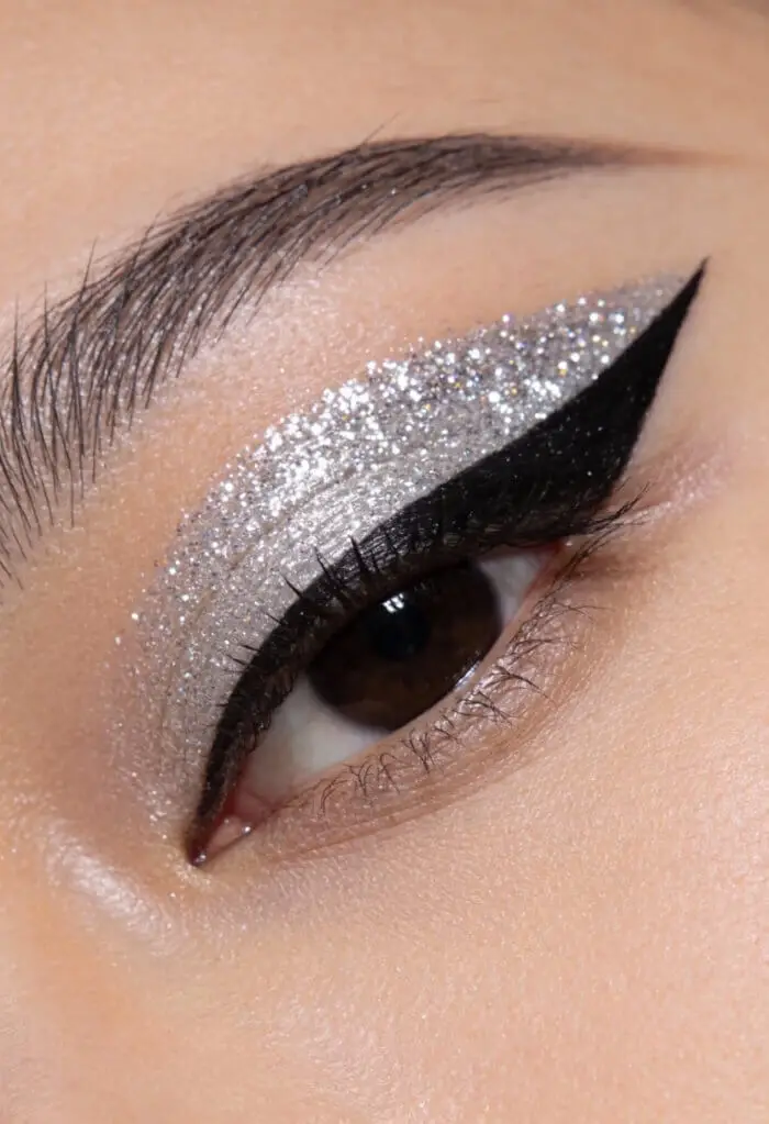 Silver Glitter Cut Crease Eye Makeup with Bold Black Winged Eyeliner