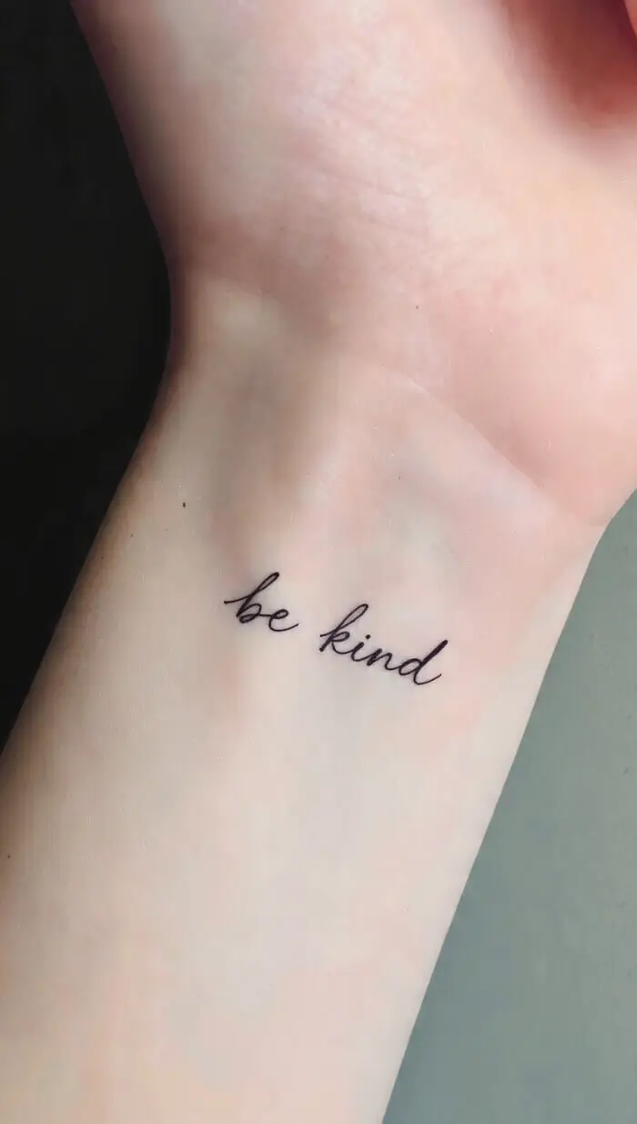  Minimal "Be Kind" Script Tattoo on Wrist – Simple Word Tattoo Design