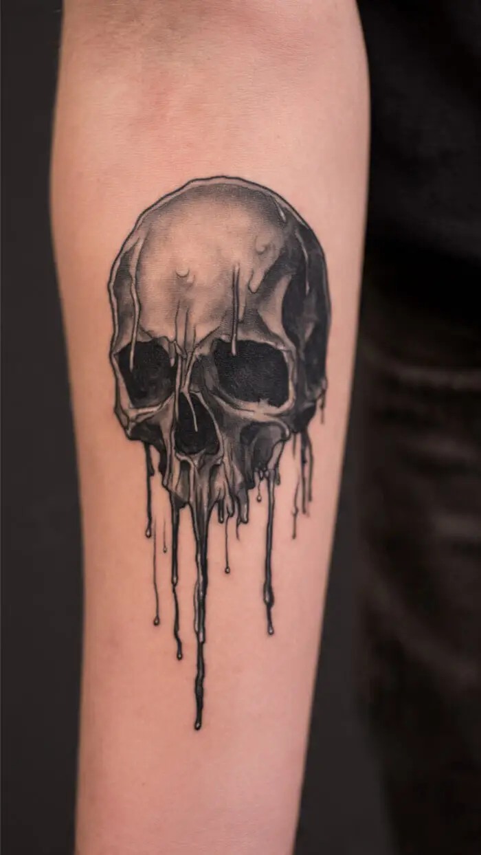 Melting Skull Tattoo – Dark Dripping Black Ink Forearm Design