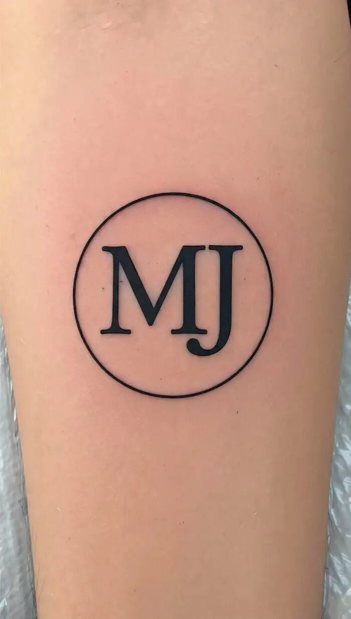 Minimalist MJ Initials Circle Tattoo – Clean Black Monogram Design