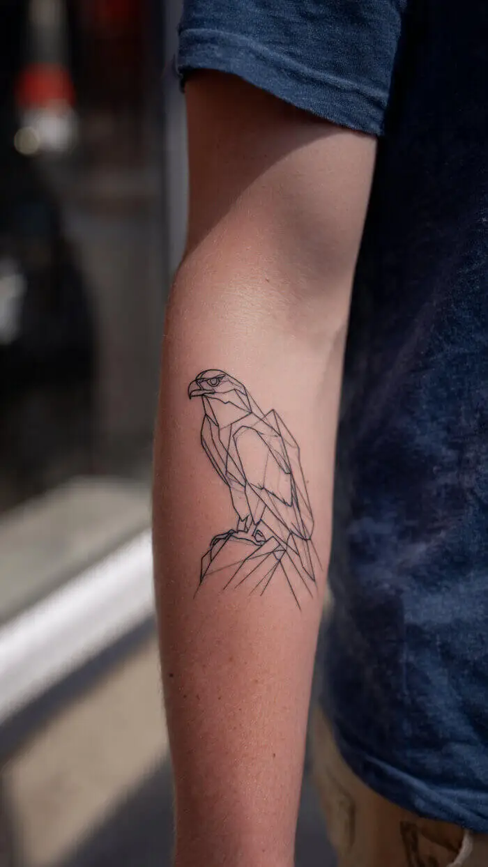 Minimalist Eagle Line Art Tattoo on Forearm – Fine Line Geometric Bird Tattoo