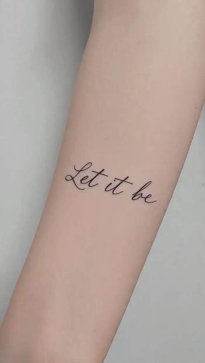 “Let It Be” Script Tattoo on Forearm – Simple Fine Line Design