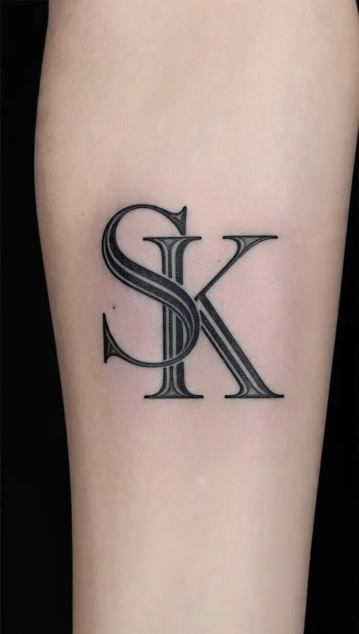 Elegant "SK" Monogram Tattoo Design – Minimalist Serif Letter Tattoo