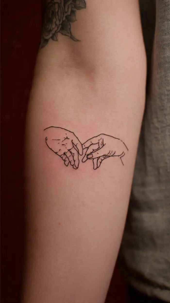 Simple Touching Hands Line Tattoo on Forearm