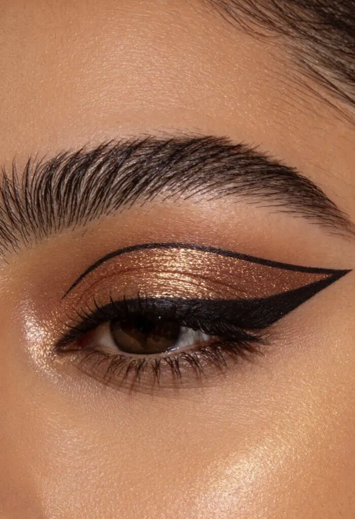 Glamorous Copper Cut Crease Eye Makeup with Bold Winged Eyeliner