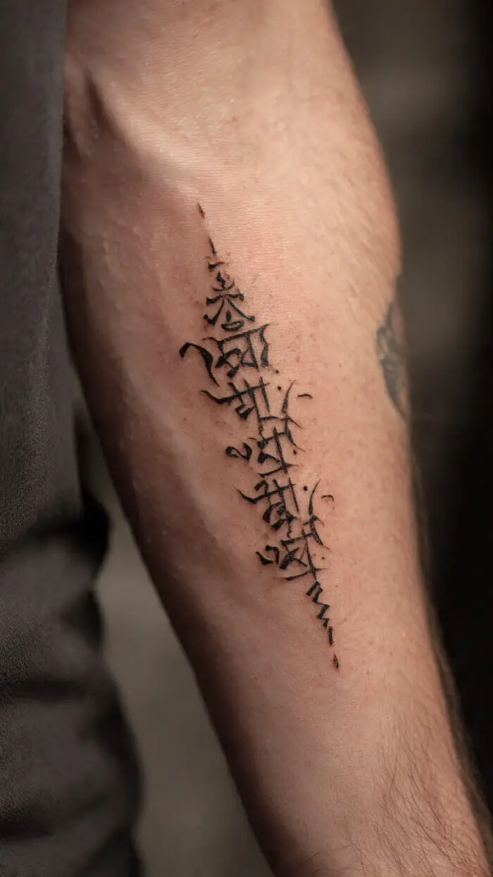 Minimalist Sanskrit Script Forearm Tattoo Design