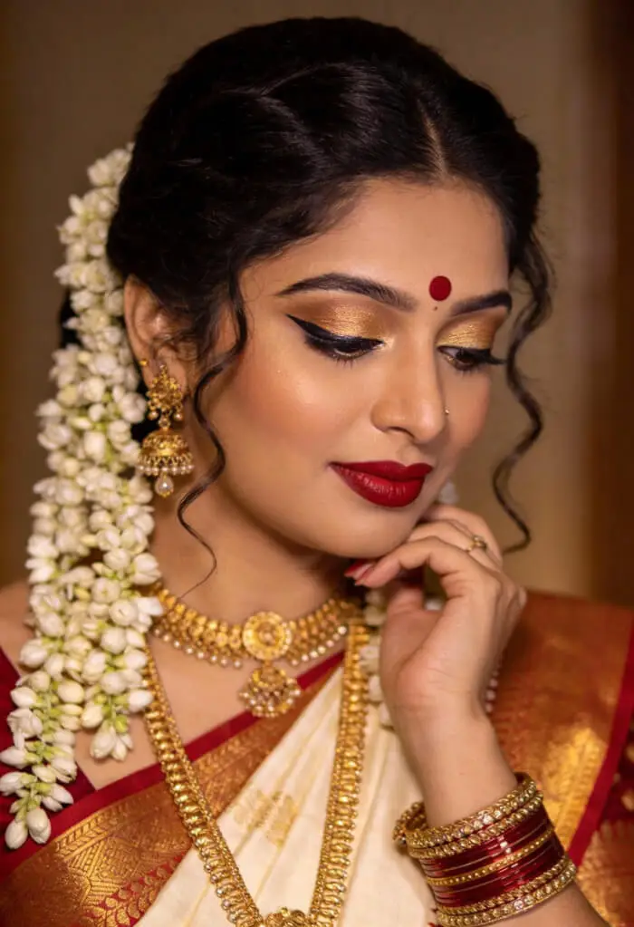 Traditional South Indian Bridal Makeup with Red Bindi & Gold Jewelry