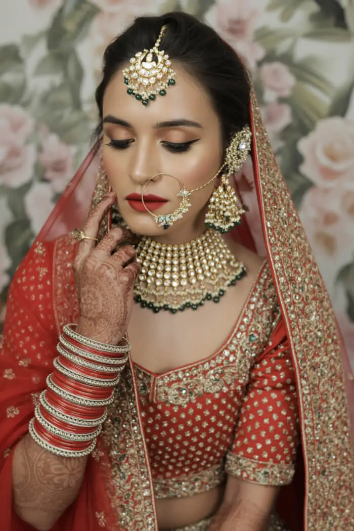 Stunning Red Bridal Makeup Look with Kundan Jewelry & Bold Glam
