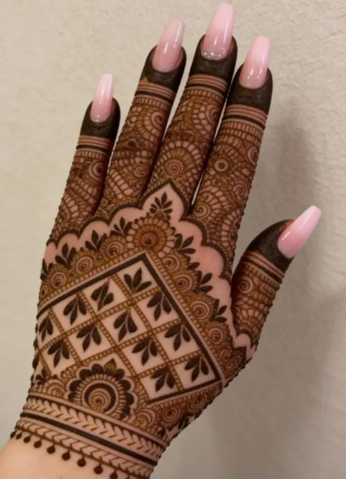 Elegant Geometric Back Hand Mehndi Design with Floral Details